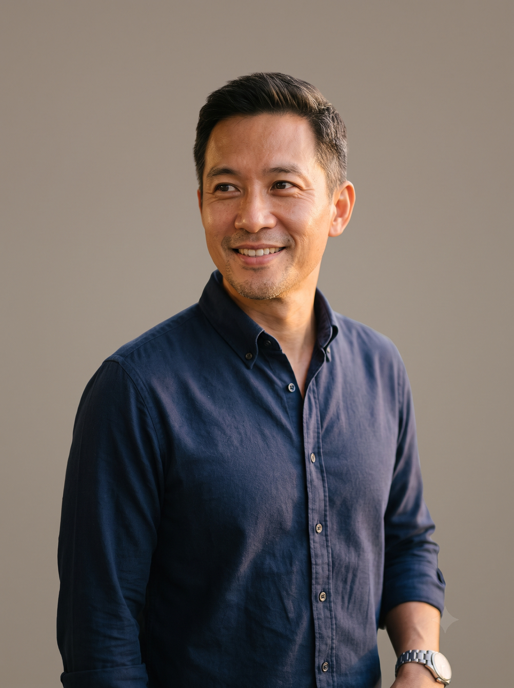 Confident middle-aged Singaporean man representing healthy biological aging at Central 24-HR Clinic